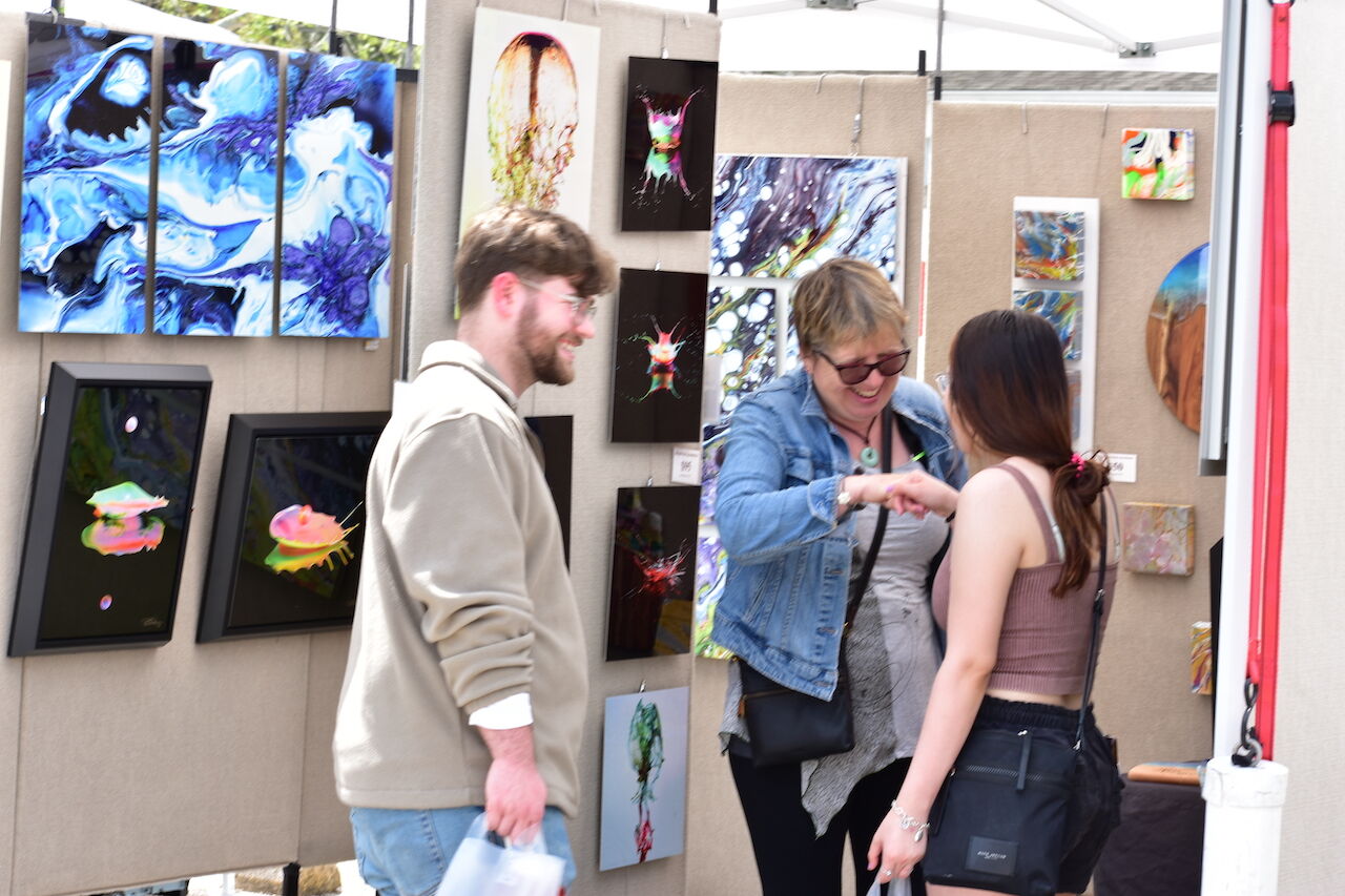 5) Artist Stella Coupe (center) in her booth at First Saturday Arts Market.JPG